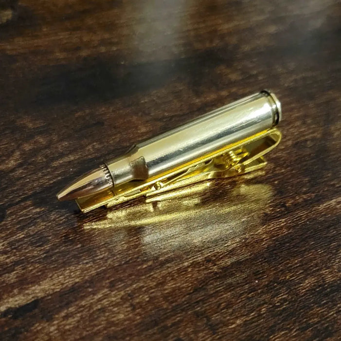 223 Bullet Tie Clip Tie Bar sitting on desk
