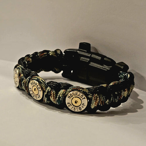 45 ACP Nickel Bullet Casing Paracord Survival Bracelet with black and woodland camo paracord color, complete with whistle, compass, and flint and striker