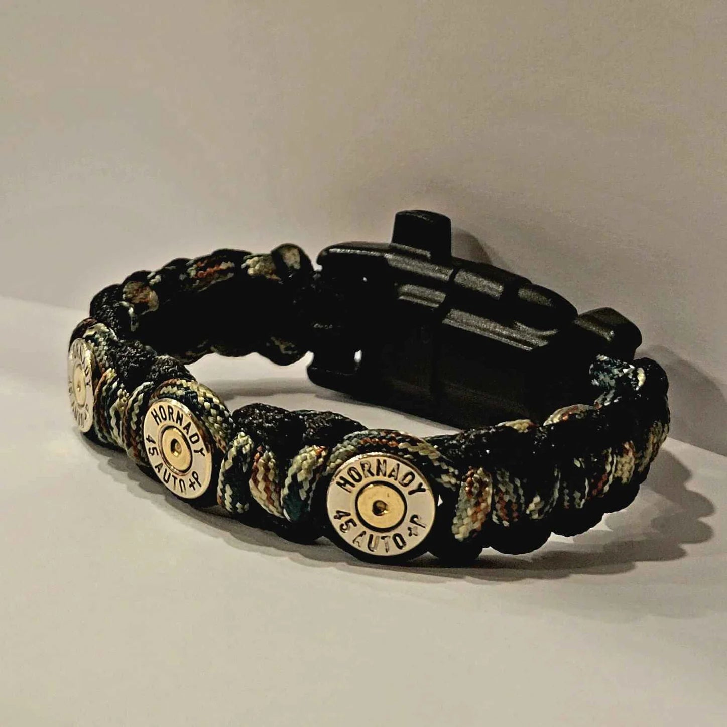 45acp Bullet Paracord Outdoor Survival Camo Bracelet complete with compass, whistle, and flint/striker