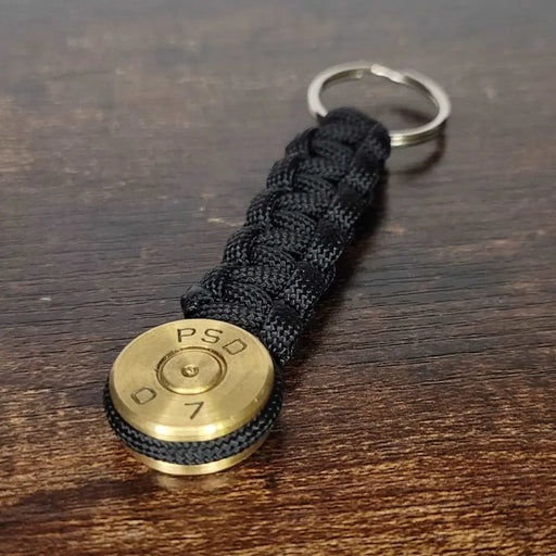 50 caliber bmg bullet paracord keychain in black paracord color